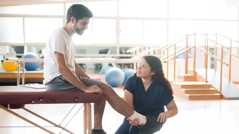 physical therapist and patient