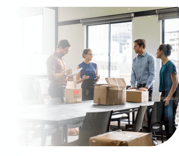 people in office standing around table - receipt of goods from purchase order