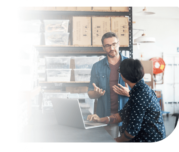People discussing vendor management at laptop