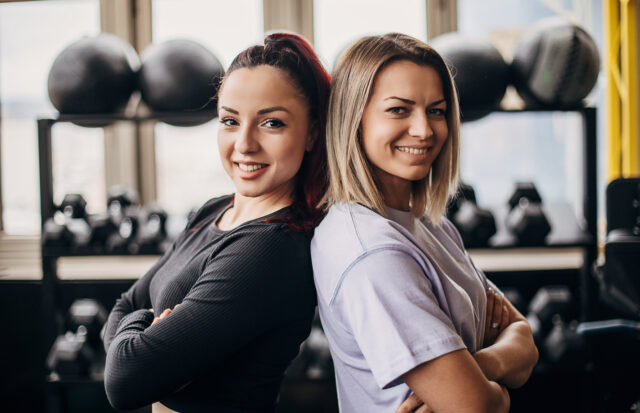 Two beautiful women in gym