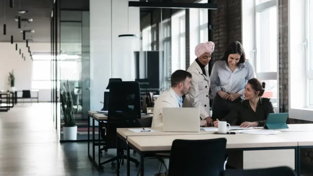 team reviewing procurement metrics