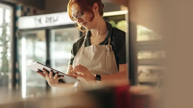 retail worker using retail asset management software to simplify store management