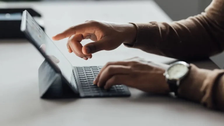 worker reviewing vendor data on tablet