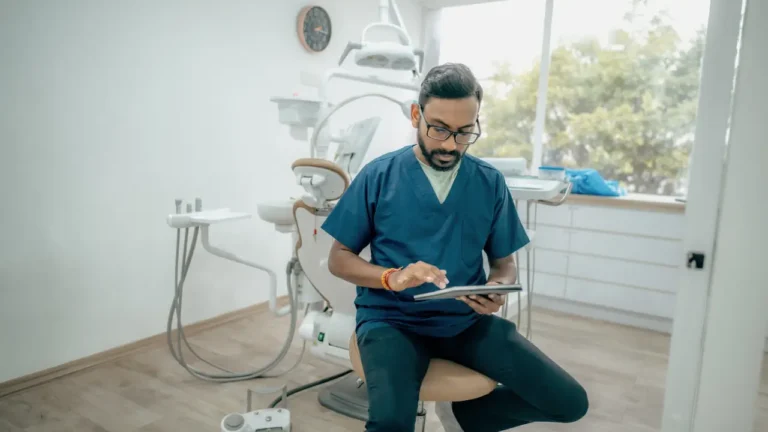 dental professional looking at best procurement software for dental practices