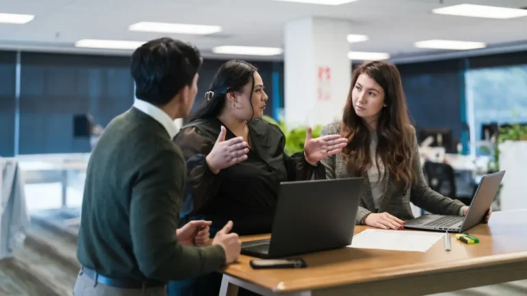 Nonprofit team reviewing grant compliance tracking