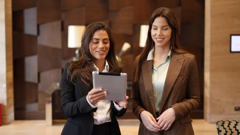 hotel managers reviewing top procurement software