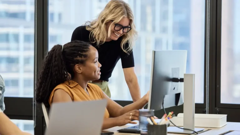 marketing team reading about procurement software